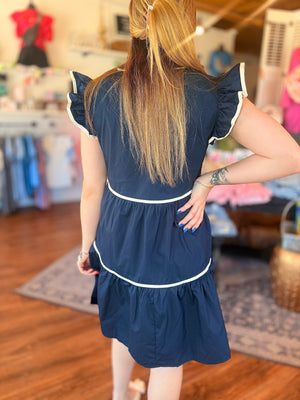 Navy Ruffle Sleeve Tiered Dress w/ White Piping Detail